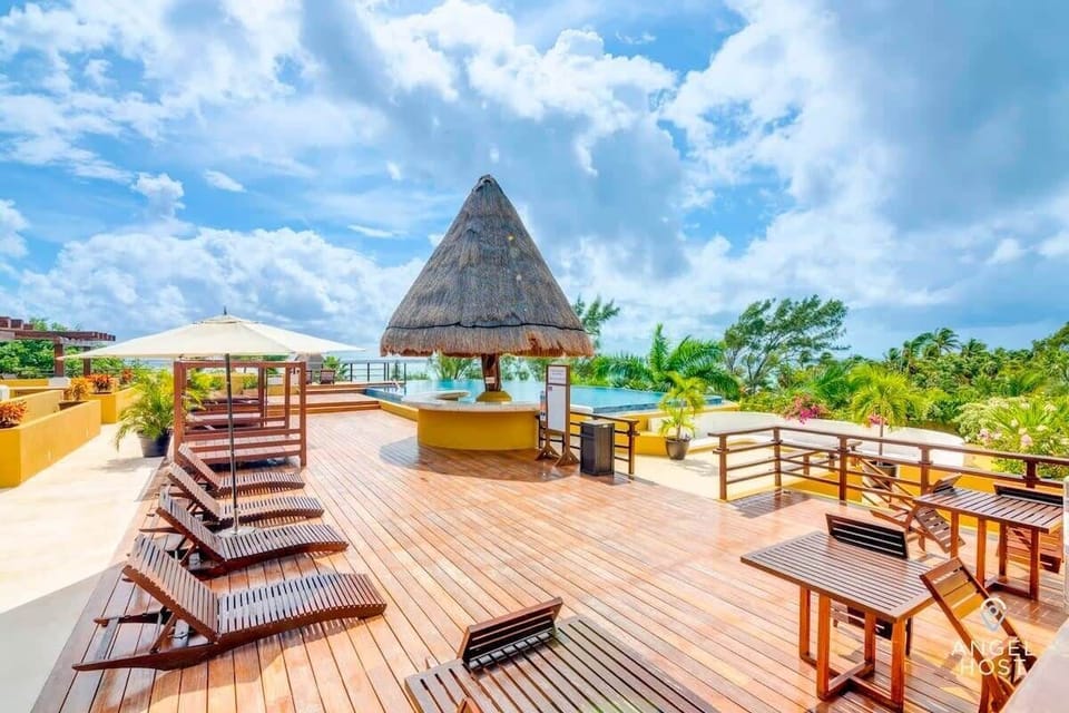 The rooftop with a private mini pool and a shared adults-only infinity pool with ocean views