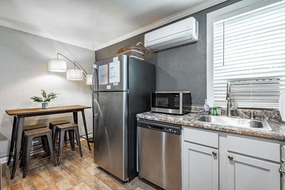 Full kitchen with dishwasher.
