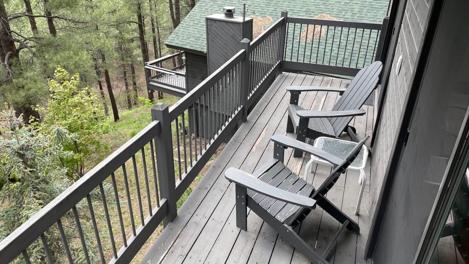 Deck off living room and bedroom. Main house is below.