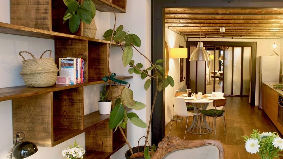 Stylish wooden shelves give you plenty of storage space during your stay.The dining table - with atmospheric lighting - comfortably seats 4 people.
