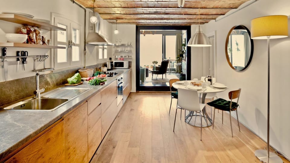 The elegant designer kitchen is very high-spec and has plenty of space for food storage and preparation.A full height fridge-freezer is just out of shot.
