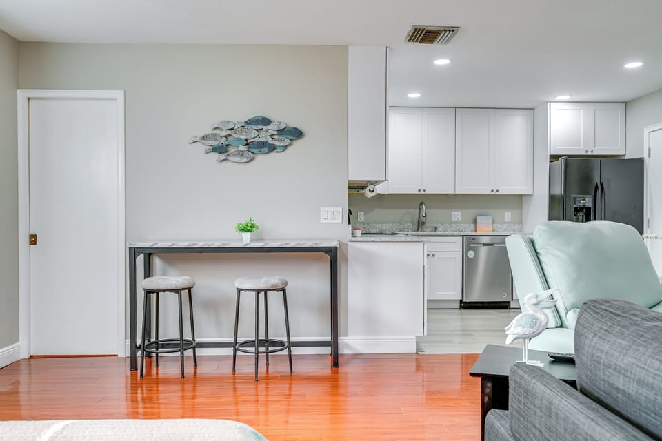 Dining Area | 2 Tables w/ Seating for 2 | Breakfast Bar w/ Additional Seating