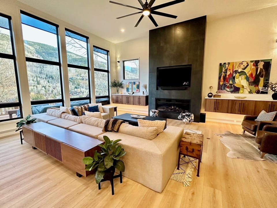 Large Great Room with incredible views, lots of seating, new TV and fireplace. 