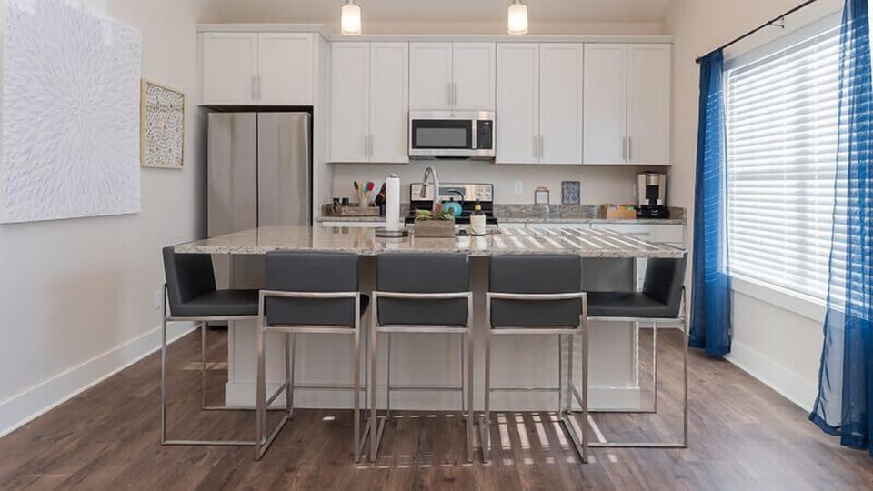 Gather around the large island and enjoy your favorite meal.