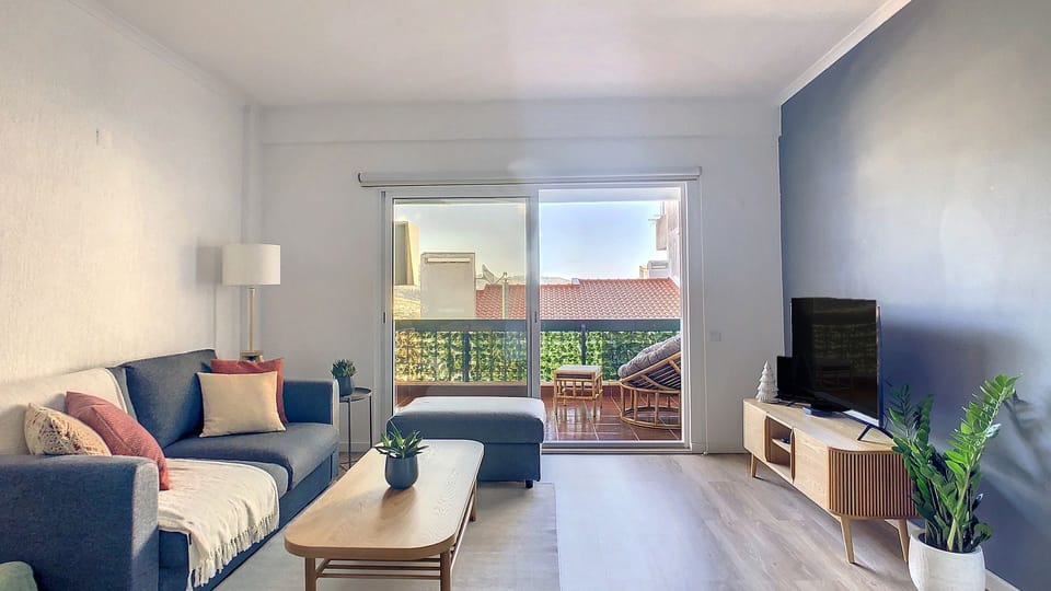 Inviting and charming living room, the ideal place to relax after a long trip exploring our island #spaciousarea #balcony #smartv