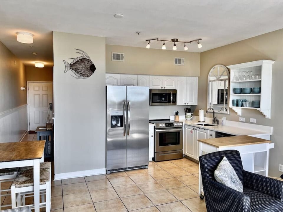 Full kitchen with quartz countertops and dining