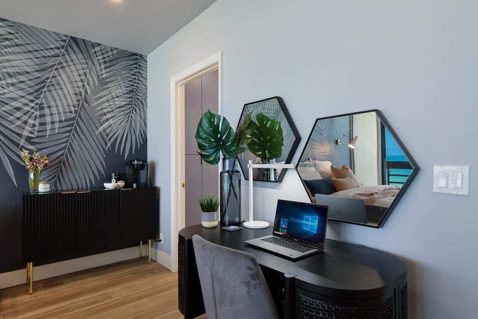 In-suite desk with "real" ocean Zoom background and in-suite coffee bar