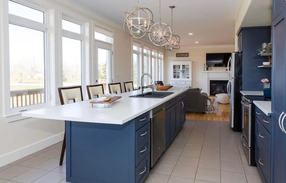 Open concept kitchen with seating for four at the island. 