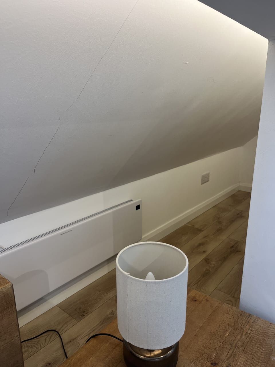 Suitcase storage behind kitchenette