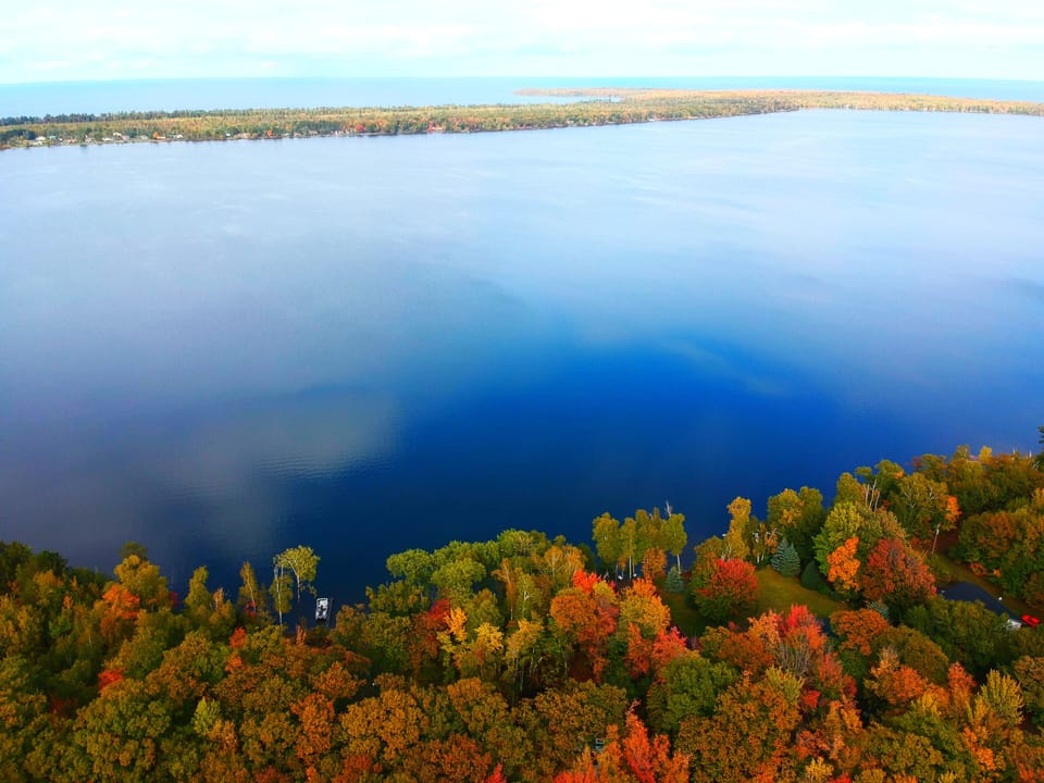 Birdseye view of Lake Independence and Lake Superior in the distance