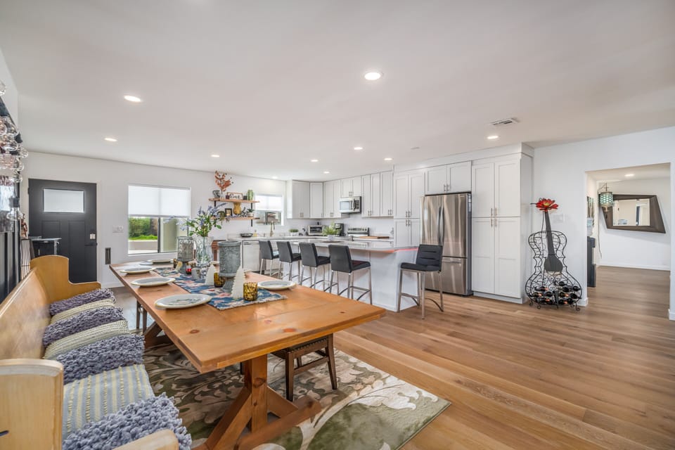Farm table seats 10, plus kitchen island accommodates another 5