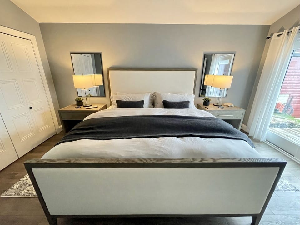 1st-floor master with king bed, private master bath, and lake views. 