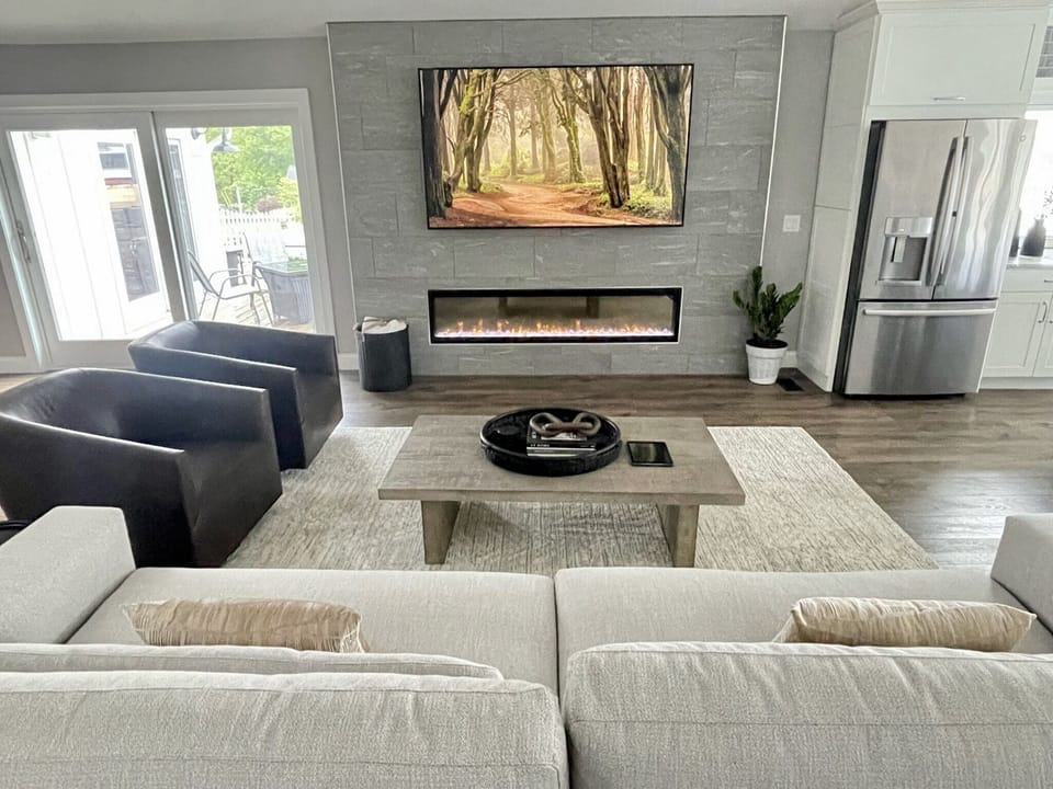 82" Smart TV, an extra large electric fireplace frame this amazing living room. 