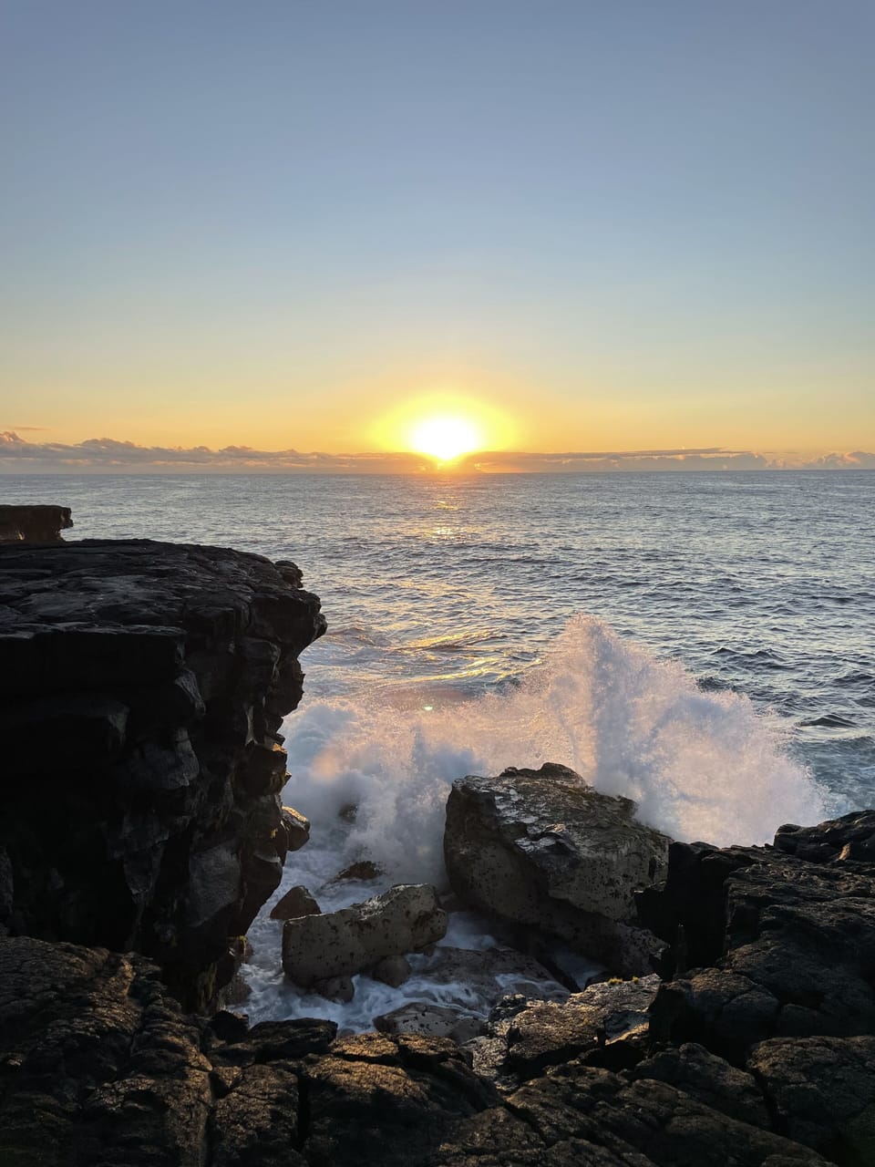 Watch the sunrise from the cliffs at Kaloli Point - just 3 blocks away