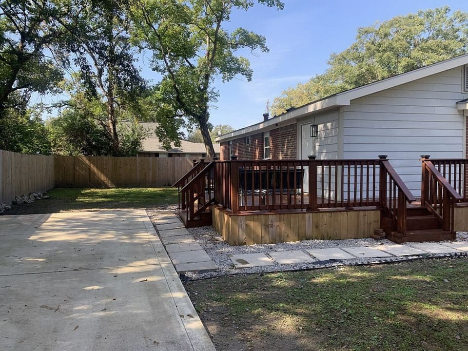 Wrap around deck/ Private driveway. Clean patio furniture and fire pit chat area
