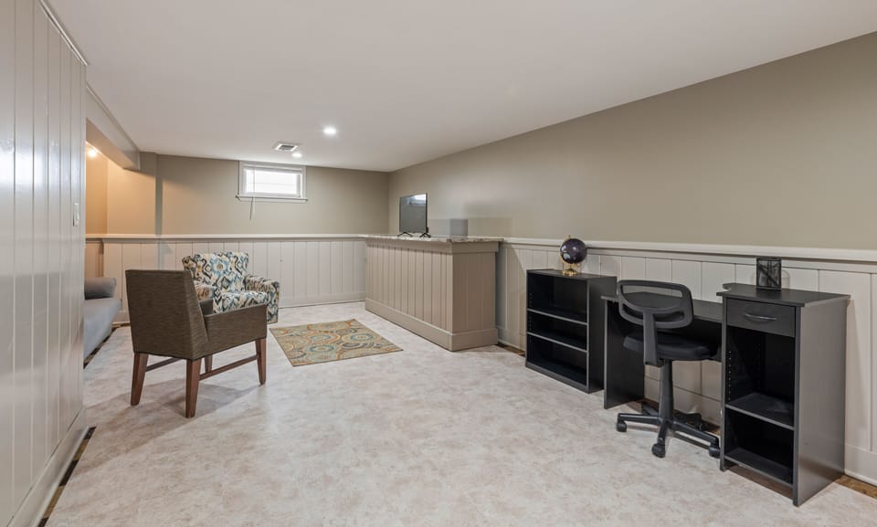 Basement living room with work desk