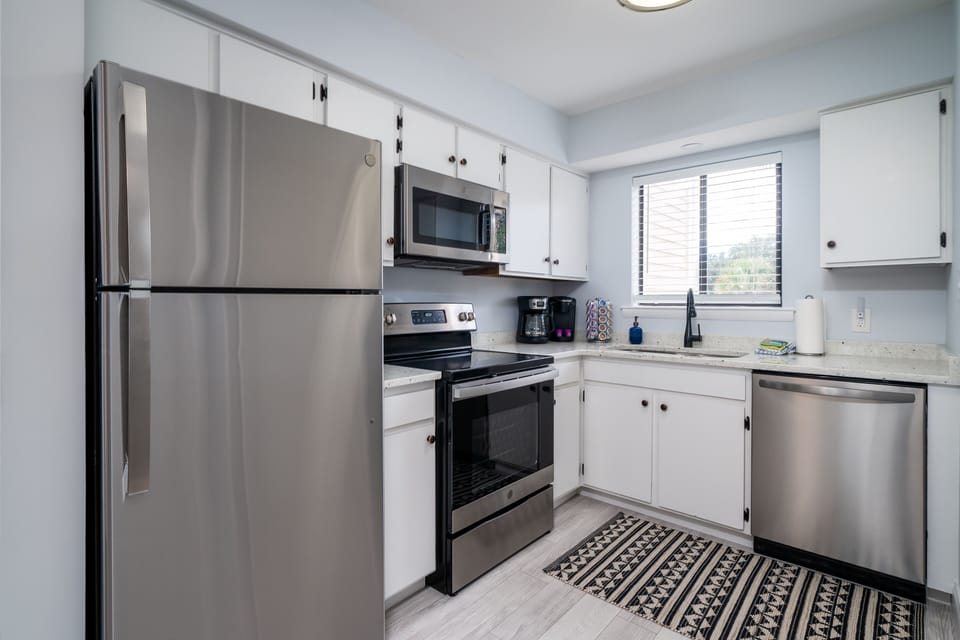 Beautiful  kitchen with stainless steel appliances and granite counters