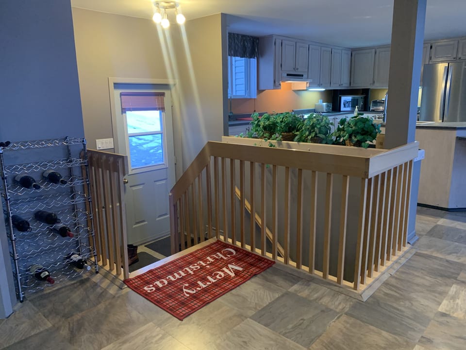Entrance, stairs to basement bedrooms & main bathroom.
