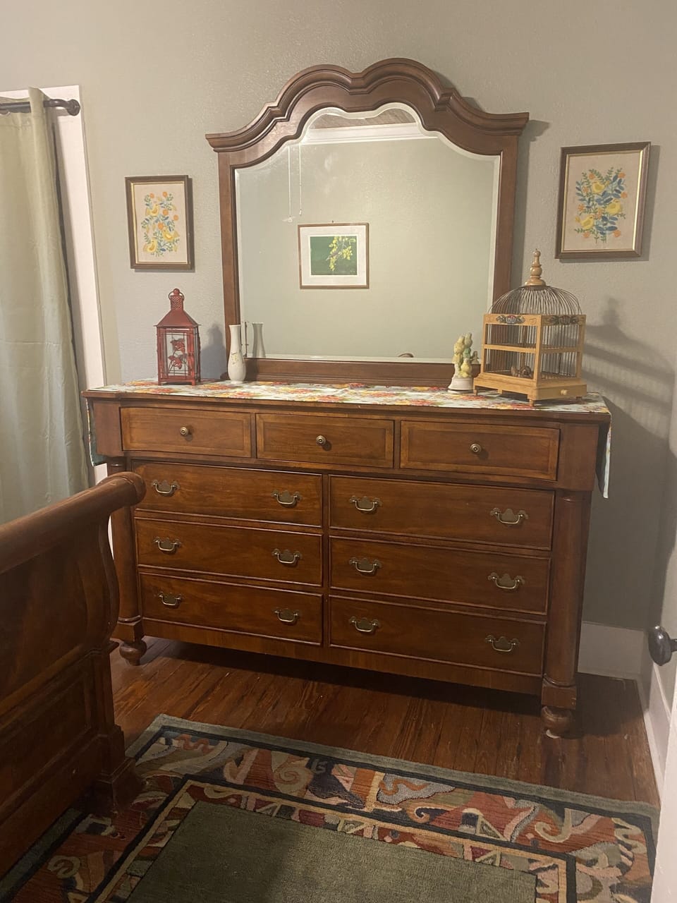 Middle bedroom has large chest. This is the "bird room" with charming touches. 