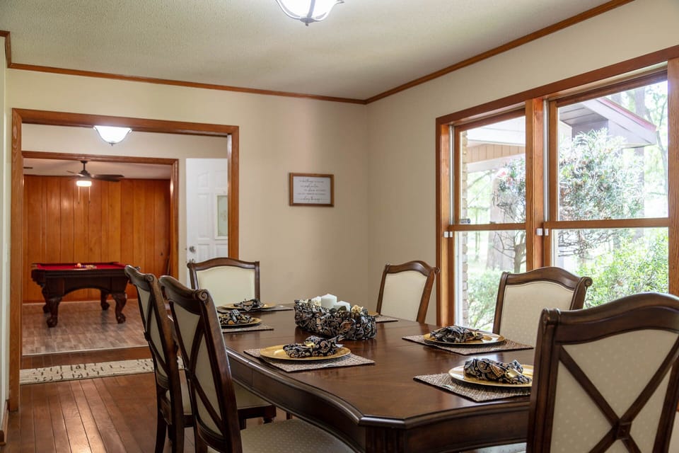 Dining room, front entrance foyer and pool room. (1)