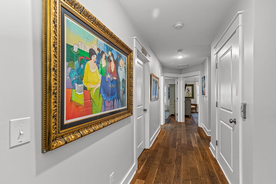 Long Hallway with beautiful Hardwood Floors. Great bedroom separation.