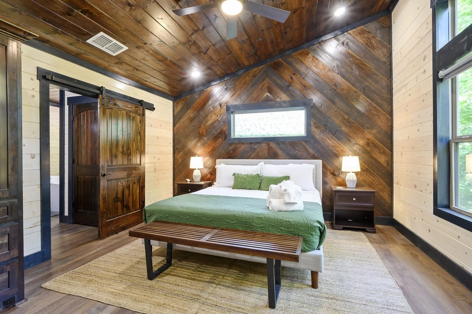 The master bedroom has a private bathroom with a walk-in shower and a bathtub.