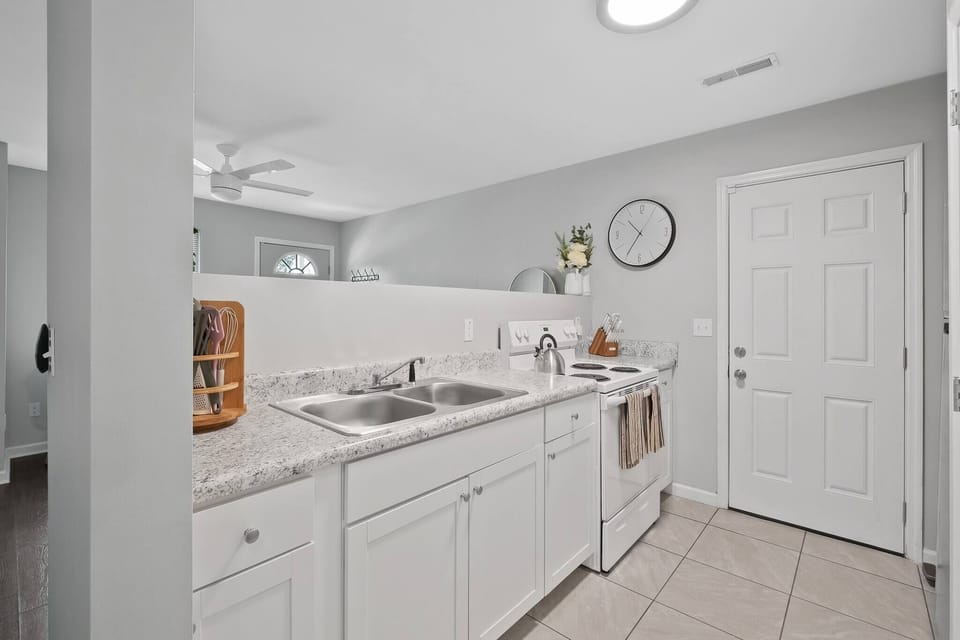 Take a look of our kitchen area, ready to be used for some home cooked meals! Our pots and pans can be found in the kitchen cabinets and there are some baking sheets in the storage drawer under the oven.