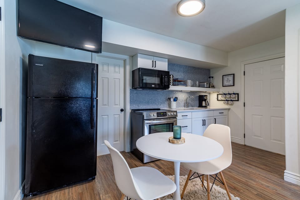 There's a full kitchen with a coffee maker and coffee and cream & sugar provided
