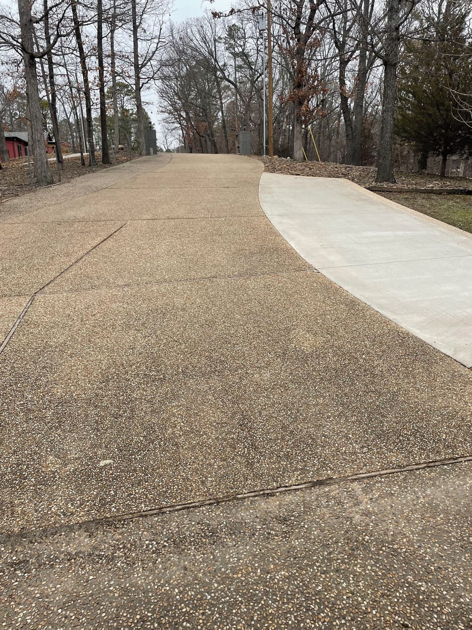 The newer parking pad is for guests.  There's room for 2 cars to park tandem.