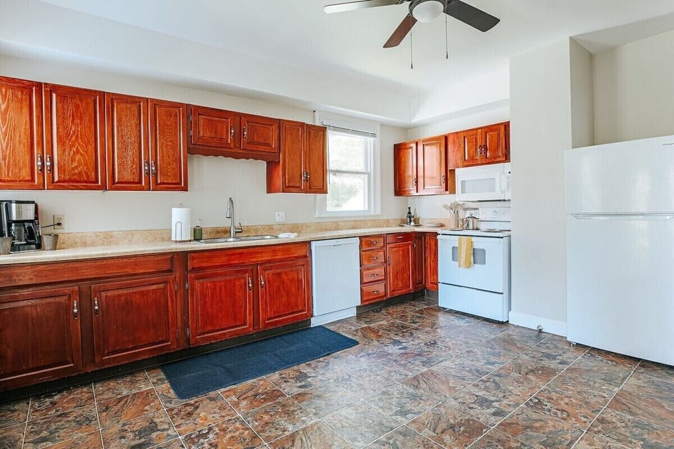 Large, fully stocked kitchen with TONS of counterspace