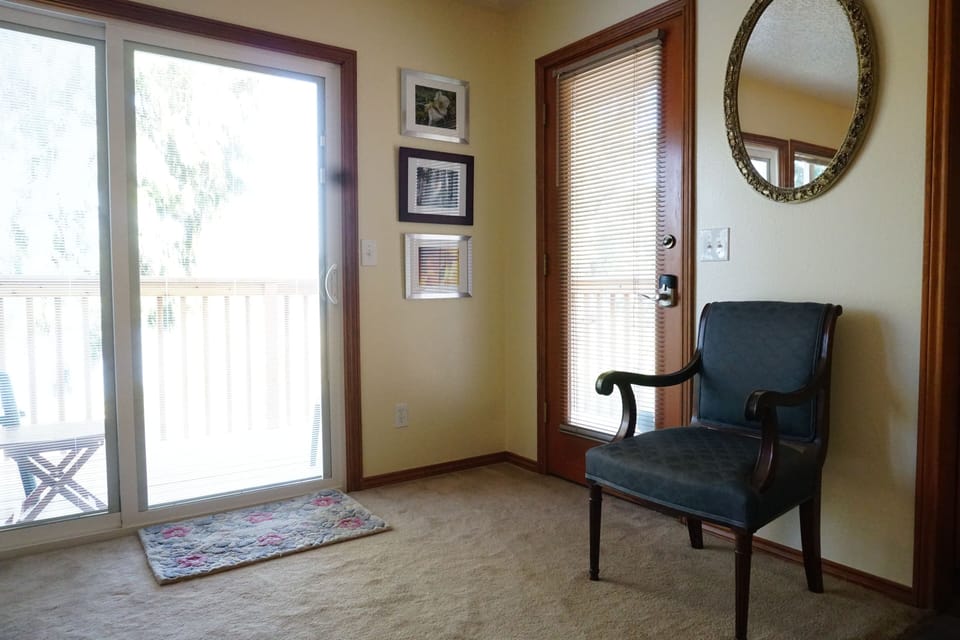 Entrance door and sliding glass door to the deck.