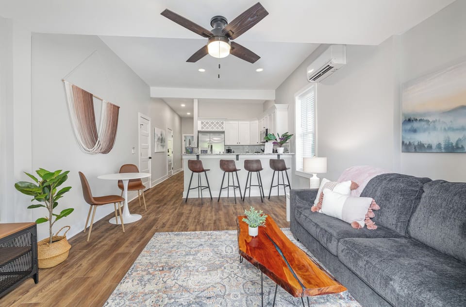 Cozy retreat with open-concept living room, kitchen and dining areas.