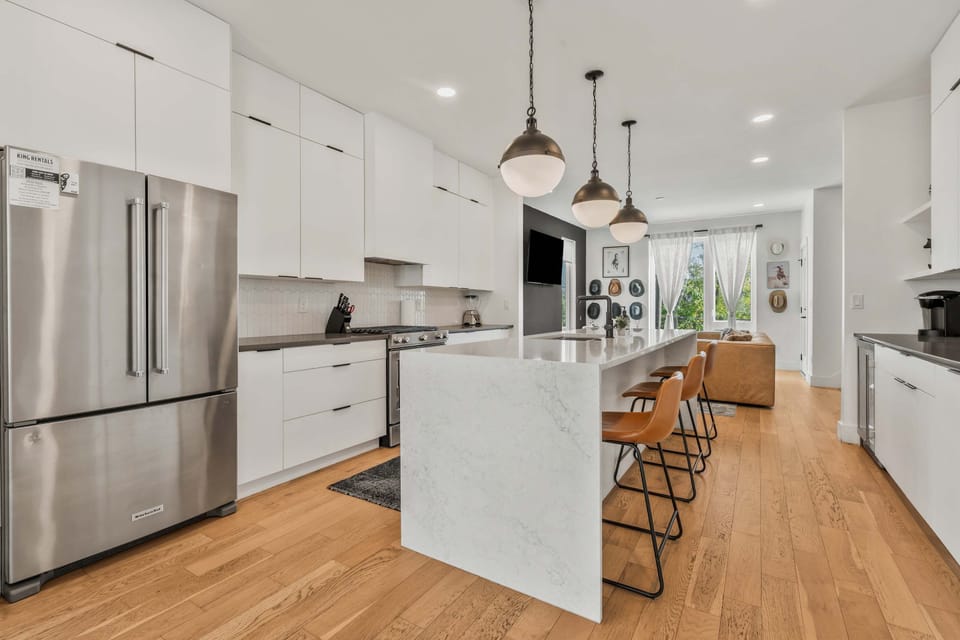 Cook with ease in a fully functional kitchen with stainless steel appliances.