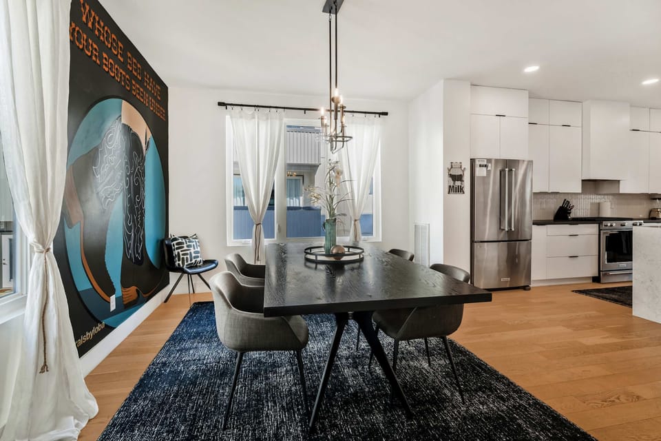 Roomy, naturally lit dining area accommodating six guests.