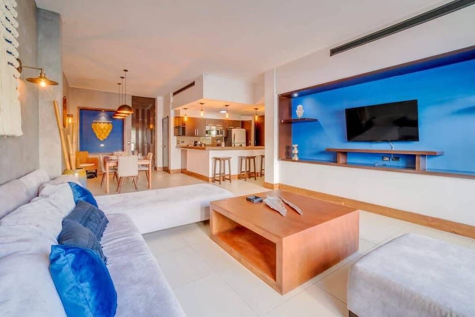 An ultra-comfy sofa and a wall-mounted TV for quality downtime.