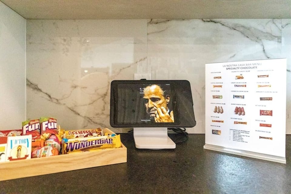 Mini Bar - La Nostra Casa style - Specialty chocolates and and sweets for the late night sugar fix.  Check out using the iPad and enjoy!