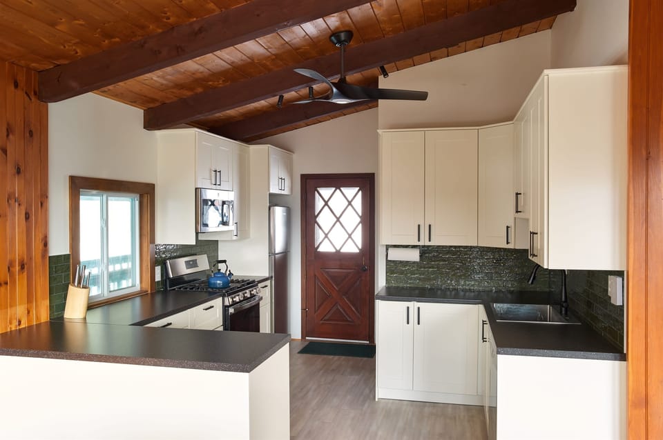 A modern mountain kitchen, recently redesigned with locally sourced, Green Mountain-inspired artisan tile.