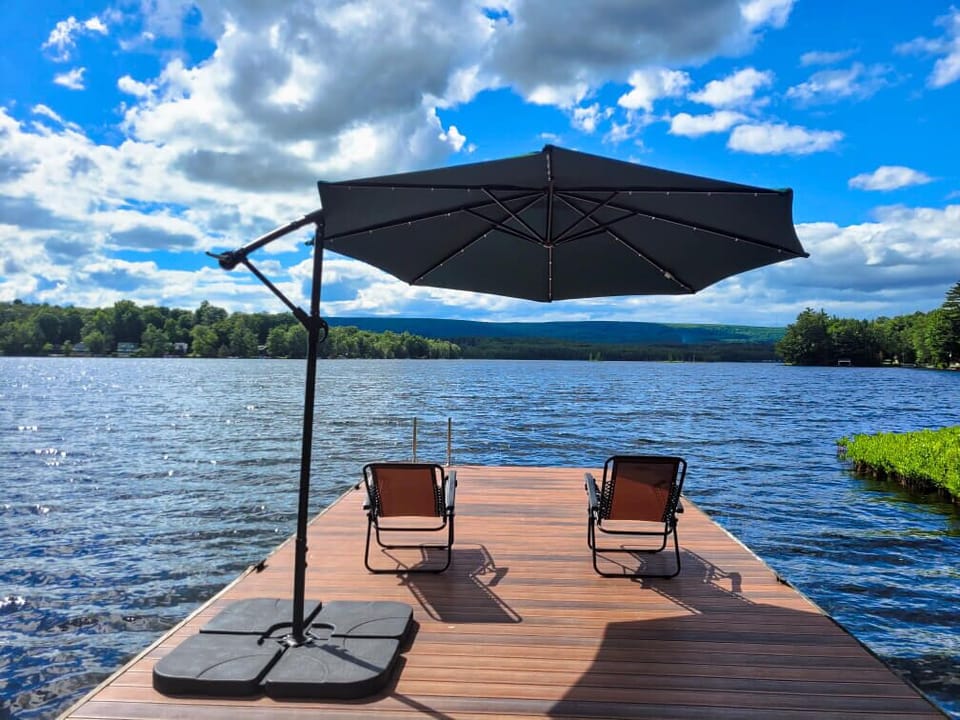 Relax on the dock. Tilting & swinging umbrella if you want shade. More chairs available.