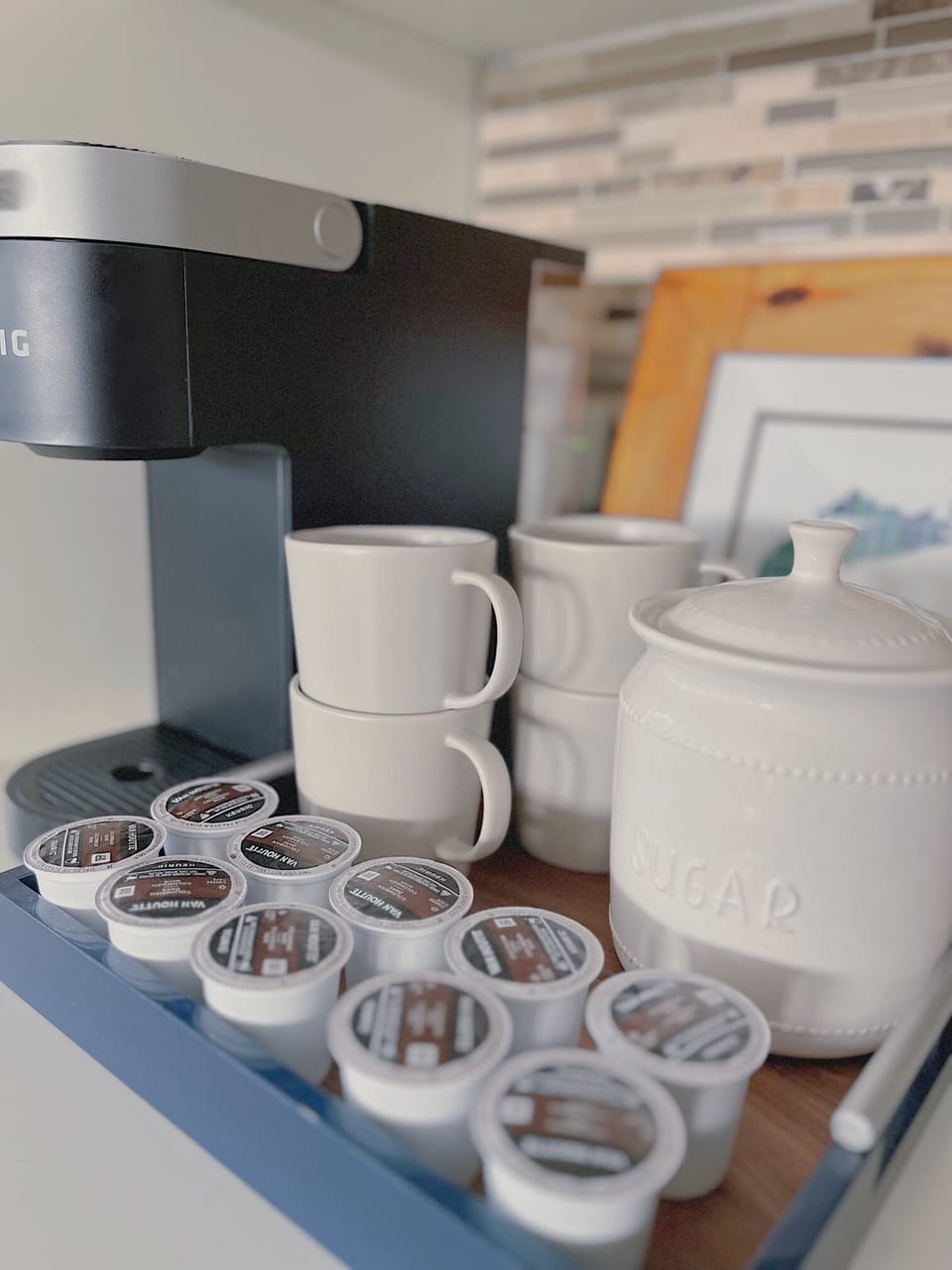 A stocked coffee bar with a Keurig machine