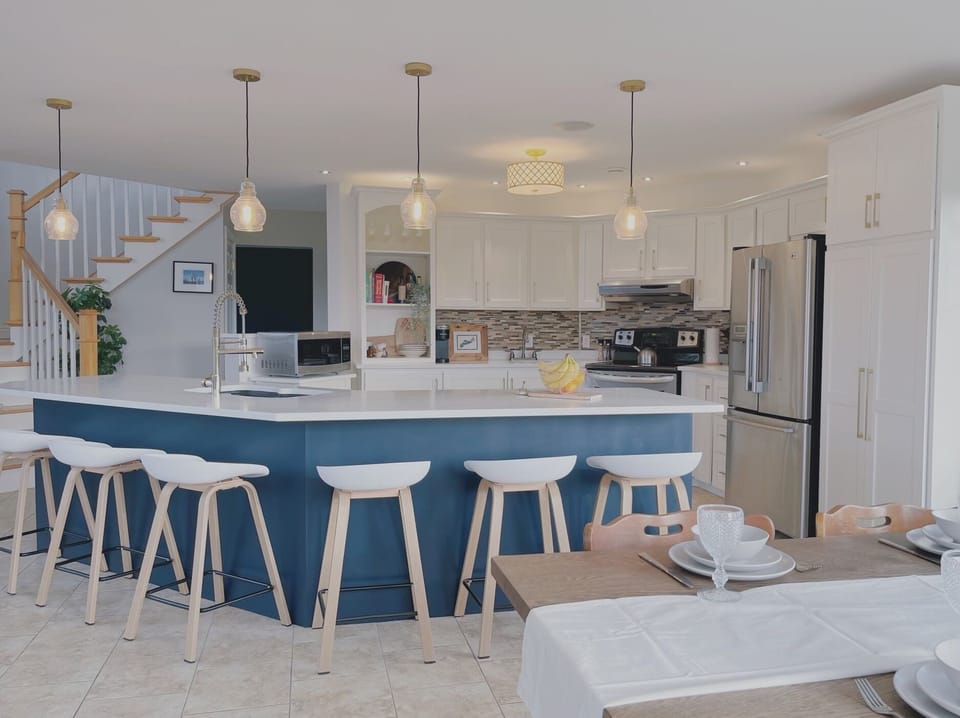 A fully stocked kitchen with lots of seating around the island