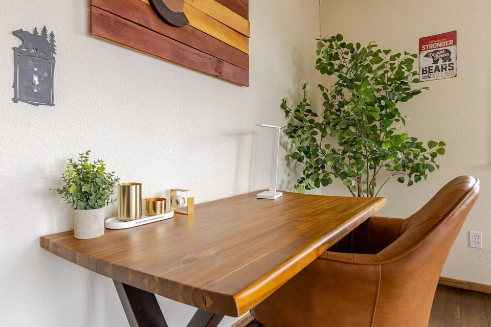 Sturdy solid wood desk with a dimmable light and wireless charging lamp.