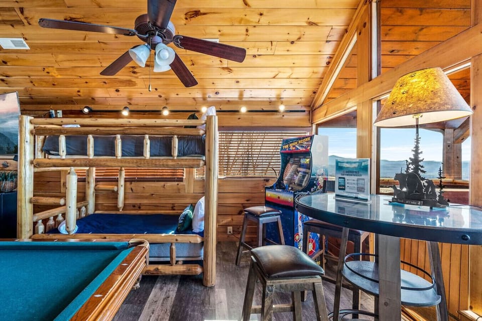 There are bunk beds, additional table seating, and an arcade game for hours of entertainment.