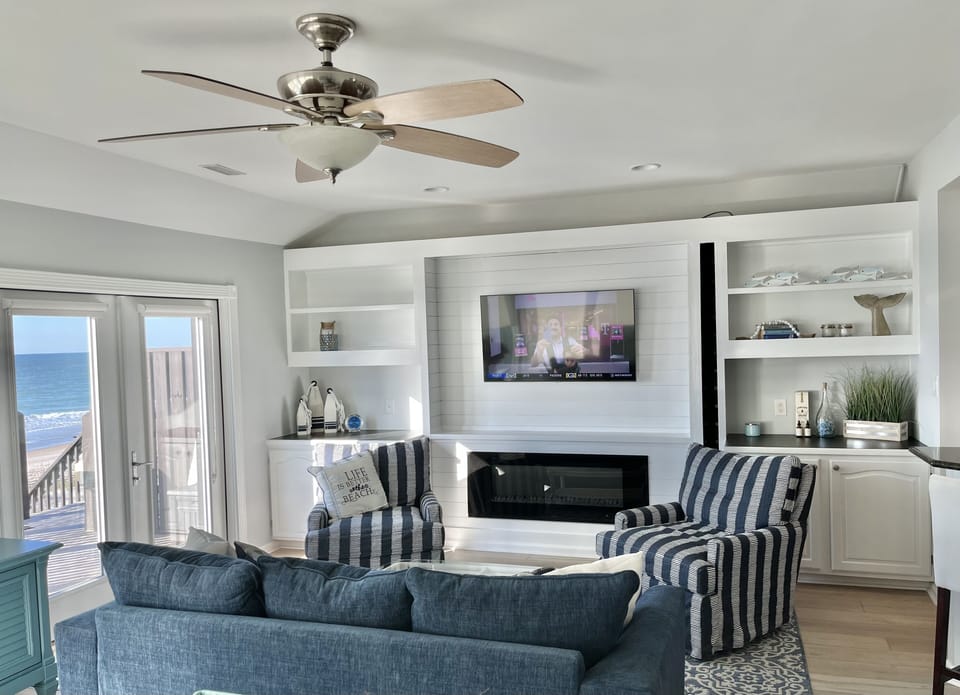 Relax and unwind with a 55” TV and electric fireplace. 