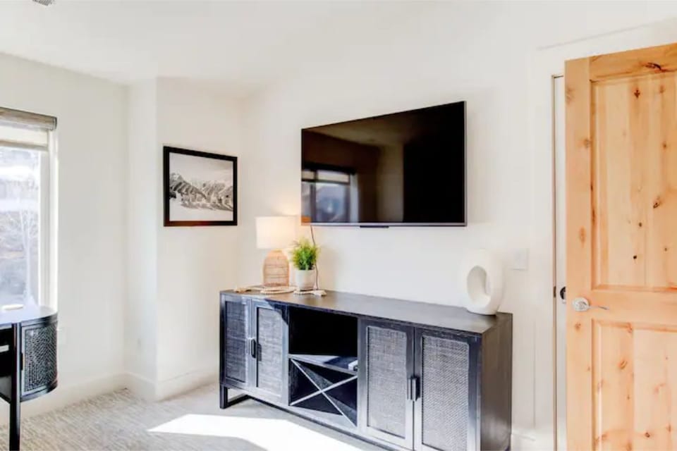 55 Inch TV and storage space in primary bedroom