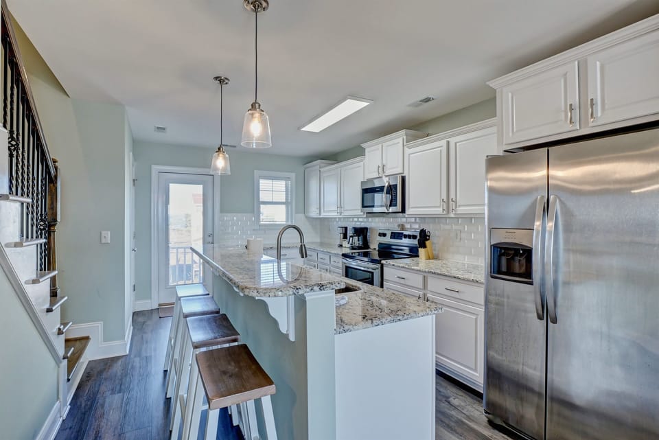 kitchen with granite countertops and steel appliances