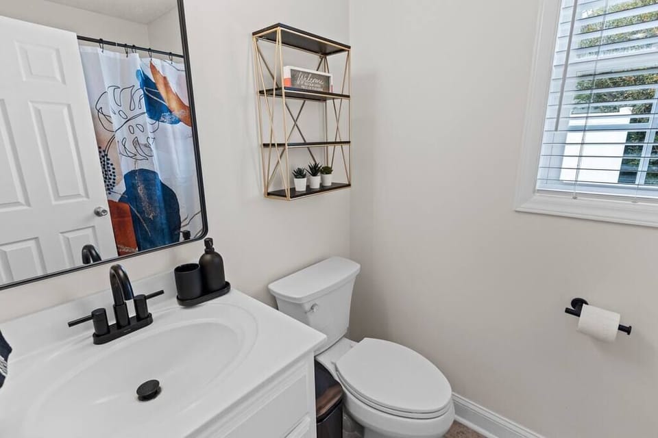 Guest bathroom with tub and shower 
