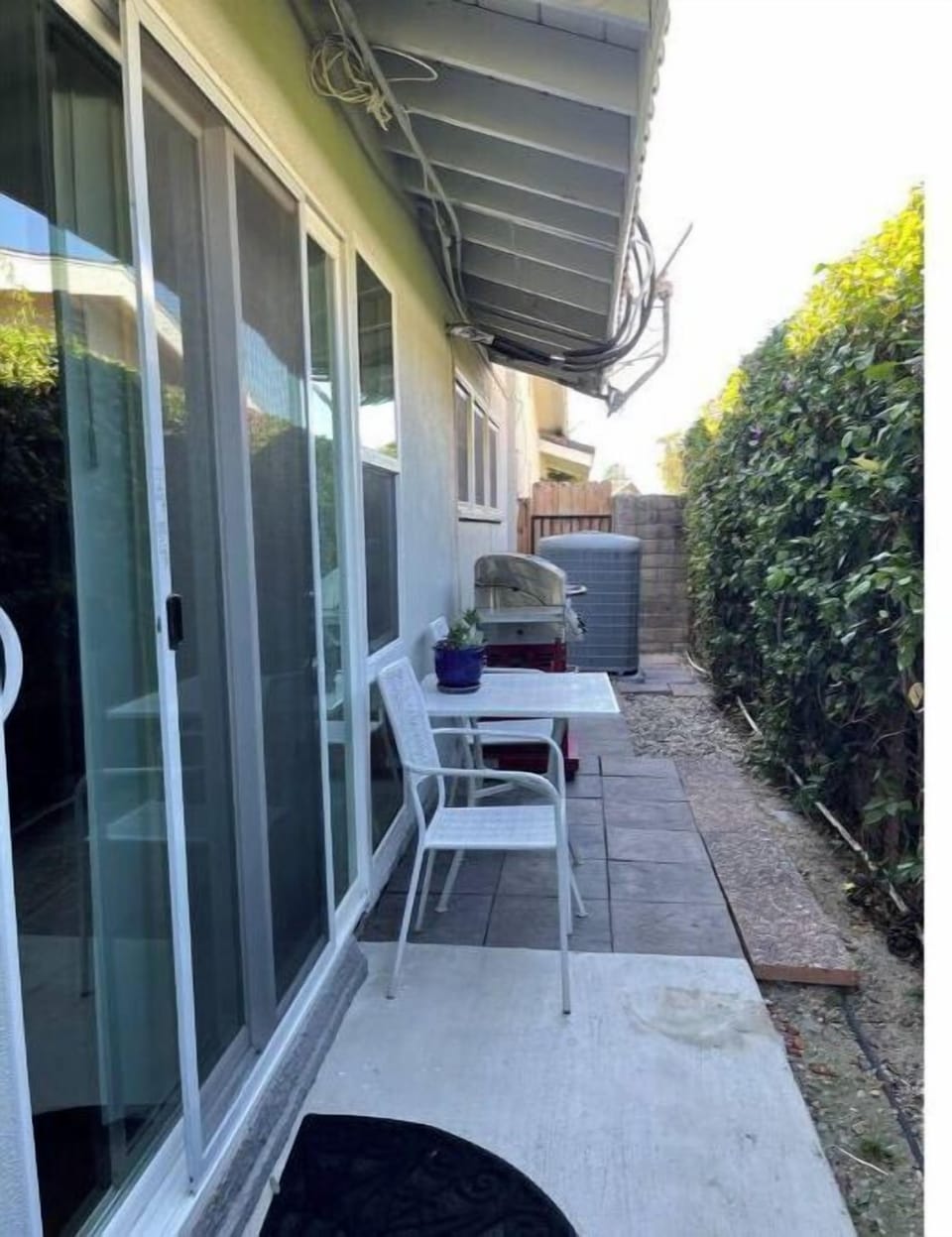 Small patio with a grill