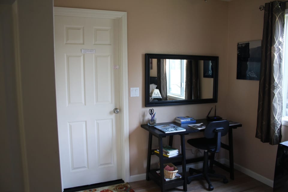 desk / work area ... door to laundry room and private deck   