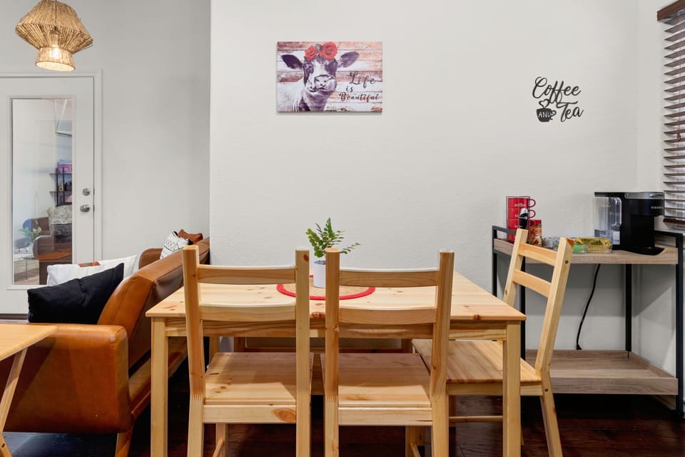 Dining area with seating for 5 and coffee and tea station.