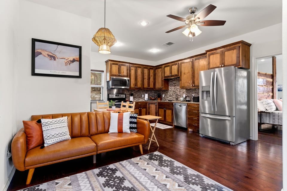 The cozy and stylish living area next to fill size kitchen